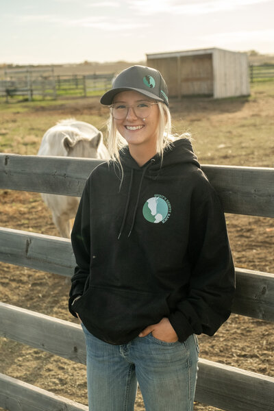 Staff wearing a Spirit Respite Ranch Premium Hoodie at the ranch.