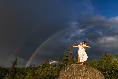 couple walking through trees taken by Minnesota wedding photographer Marcus Hanenburg Photography