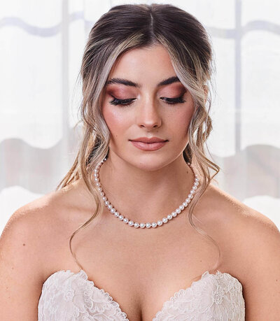 Close-up of bride with soft glam makeup — dewy skin, mauve lips, and romantic elegance by Klover Beauty in Maryland.