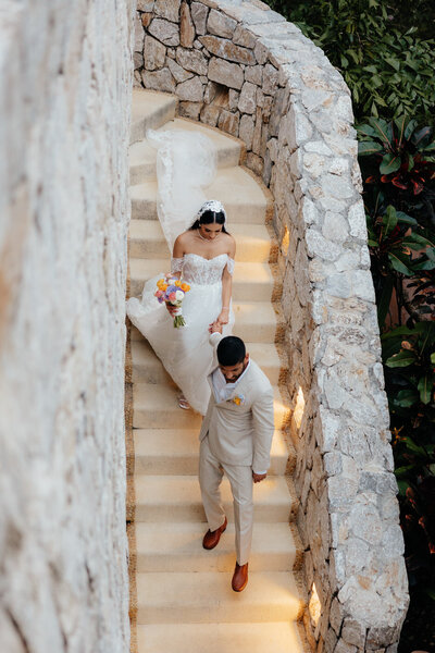 Casa Angelina Destination Wedding Couple Holding Hands Walking Down Stairs Together