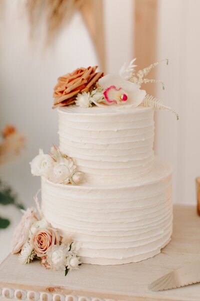 Buttercream Cake with Orchids - Bre & Chris | Converted Basketball Court Wedding – Featured in Brides Magazine