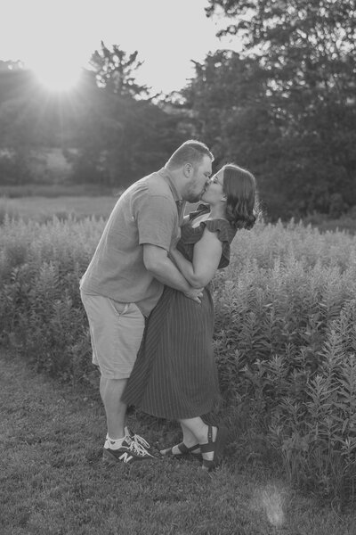 couple holding hands walking along the beach
