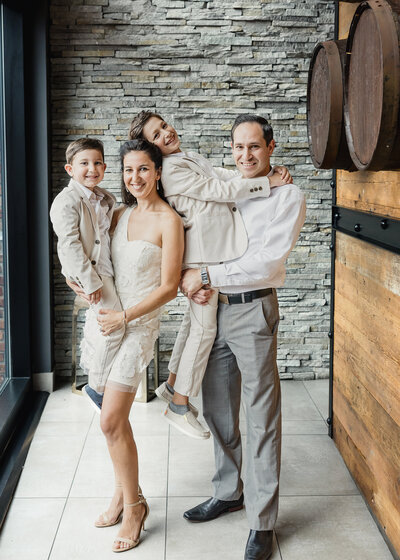 Family poses playfully at a birthday party in Essex County, NJ
