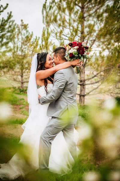 Ashley and Danny hugging and about to kiss on their wedding day