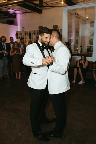 Two grooms during their first dance.