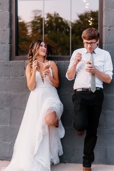 bride and groom eating ice cream