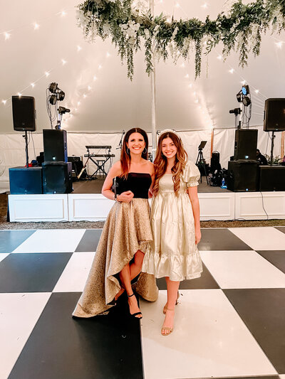mom and daughter at wedding of bride who wore a beautiful gown