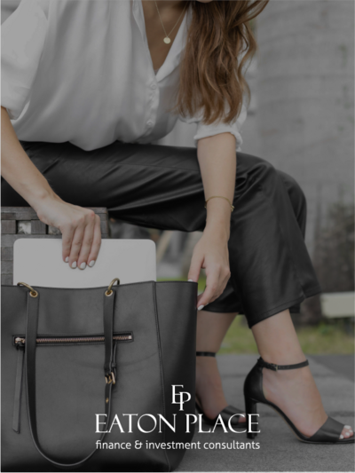 Young business woman placing laptop in black bag showing how logo can be adapted to a different type of business | Brand By Design