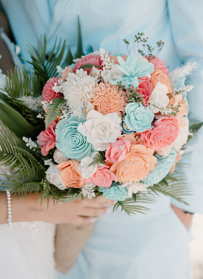 a bridal bouquet made of colorful wooden flowers taken by a destination wedding photographer