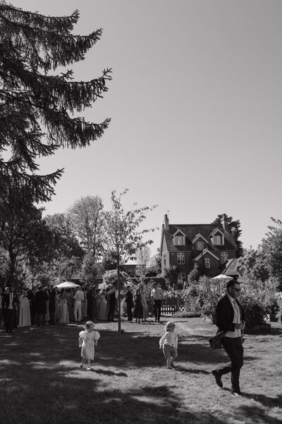 Wedding photographer captures couple taking a stroll hand in hand at their french chateau wedding.