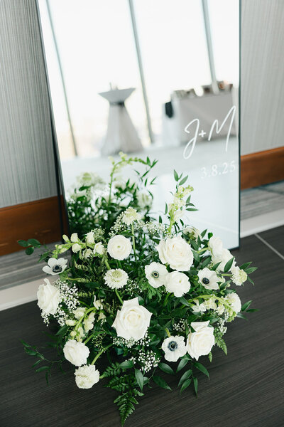 Close up of florist cutting greenery for centerpiece