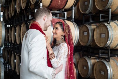 Jewish groom and Bangladesh bride stand together at the district winery