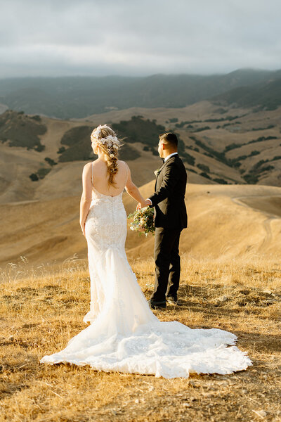 bride and groom interlocking arms