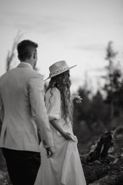 bride and groom walking outside together