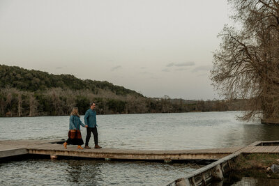 Engaged couple holding hands at South Congress in Austin, photographed by Valeria Ortega, couples photographer.