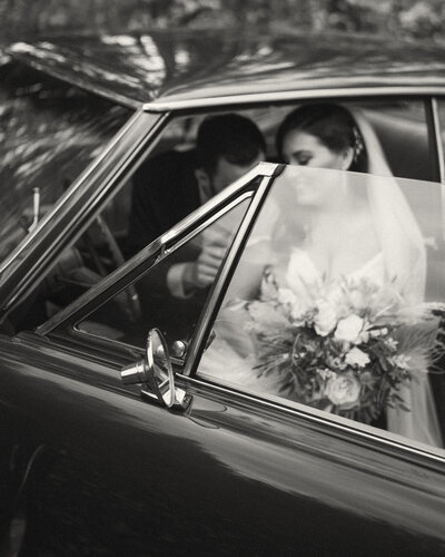 Wedding couple in car