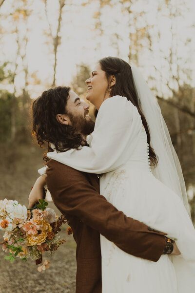 groom picking up bride