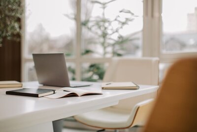 Office chair at meeting desk empty computer soft lighting modern