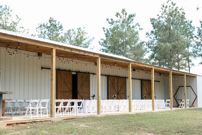 Outdoor reception setup at The Grove with farmhouse tables, elegant lighting, and western-modern décor.