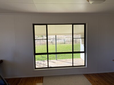 Custom glass windows with aluminium frames, designed for energy efficiency and modern home renovations in Roma QLD.