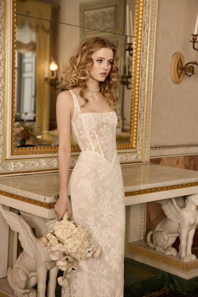black and white image bride wearing  long sleeve lace wedding dress