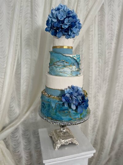 Blue and gold themed wedding cake