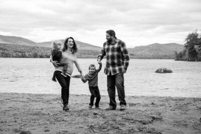 Family walking together with water in the back | Family Photography Session Taken By Maine Photographer