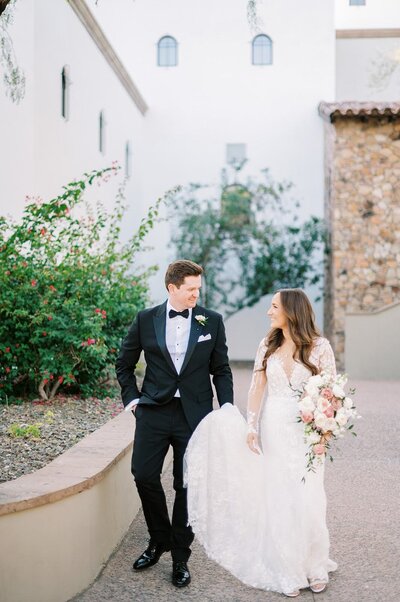 Bride and groom overlooking Camelback Mountain at sunset, planned by J.Starr Wedding Company