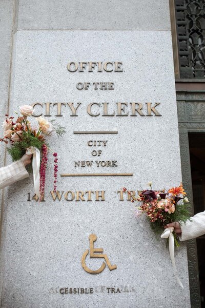 NYC two city hall elopement bouquets with winter coats