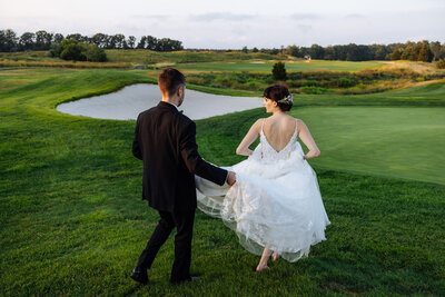 Bride and groom during sunset at Scotland Run Country Club
