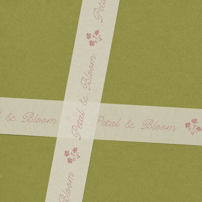 a pink envelope and a printed floral card