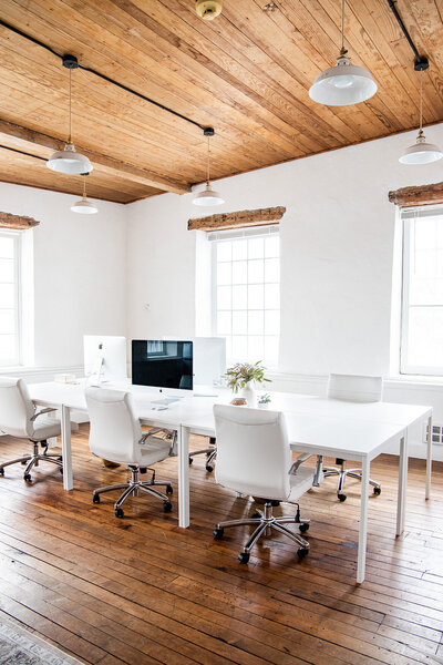 office space with desk and computers