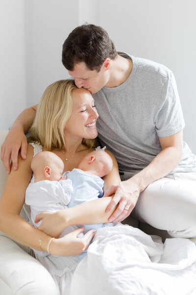 Parents holding newborn at in home lifestyle newborn session in New York City