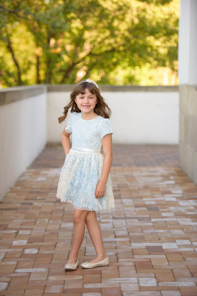 little girl smiling during family pictures at Boise Depot with photographer Tiffany Hix