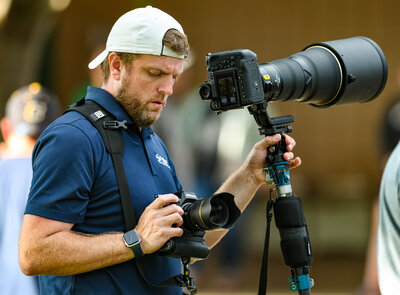 photographer marshall stephens and a senior baseball player at a photoshoot