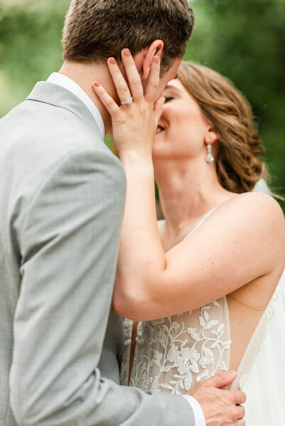 A beautiful bride and groom about to kiss, posing for a wedding photo in Wisconsin