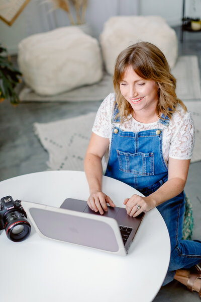 Alison Amick Brett on computer  son in her studio