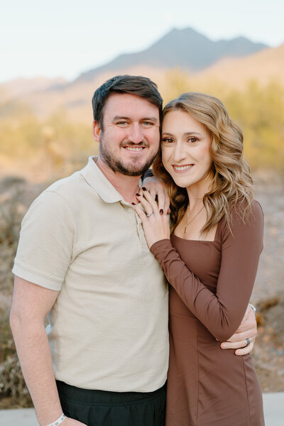 a close up photo of the owners of the green bean coffee cart