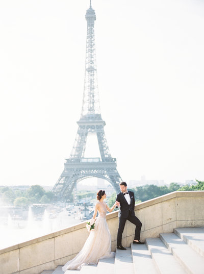 Bride and groom at Eiffel Tower in Paris, France