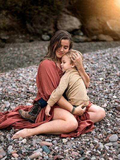 Mother holding son in her lap