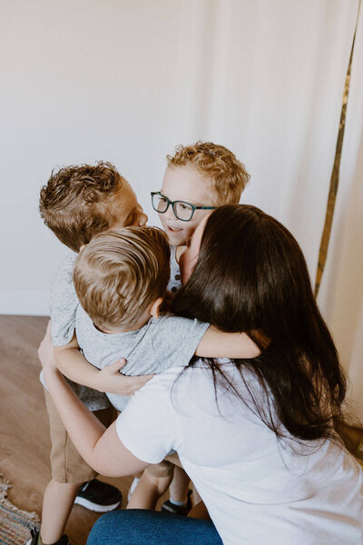 babysitter hugging children