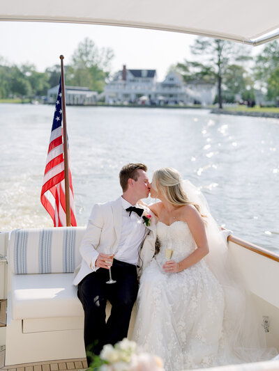Bride and groom hugging on sailboat at Chesapeake Bay Maritime Museum
