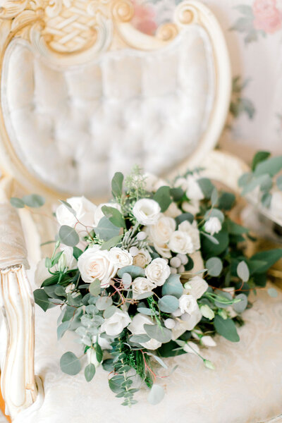 wedding flowers on the gorgous armchair