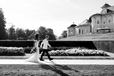 Bride and groom walking on a path at The K Club in Kildare, Ireland