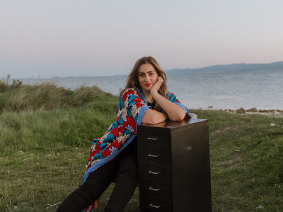 Brand designer Marta Custic working at outdoor filing cabinet workspace with natural lighting