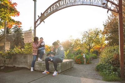 family of four at local park near golden hour