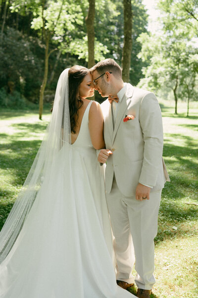 a couple touches forheads in a romantic embrace