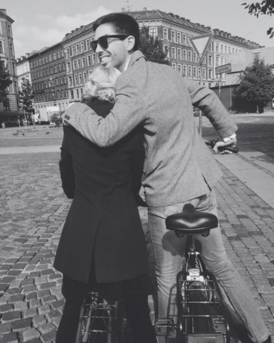 Loving couple embrace on bike ride black and white