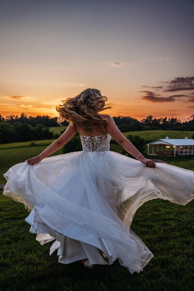 Bride during golden hour taking in the sunset 
