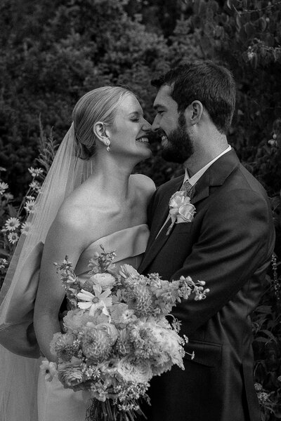 wedding at the denver botanical gardens bride and groom smiling at each other